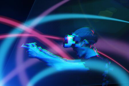 Man with virtual reality headset is playing game. Image with glitch effect.の写真素材