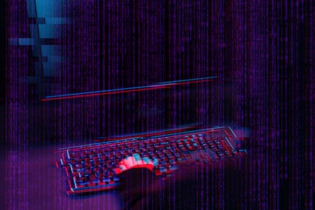 Hacker working with computer in dark room with digital interface around. Image with glitch effect.