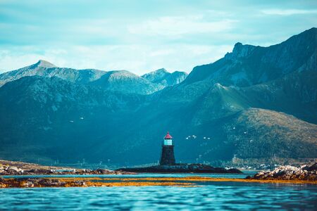 Lighthouse, hills, sea, sky in Norway on summer.の写真素材