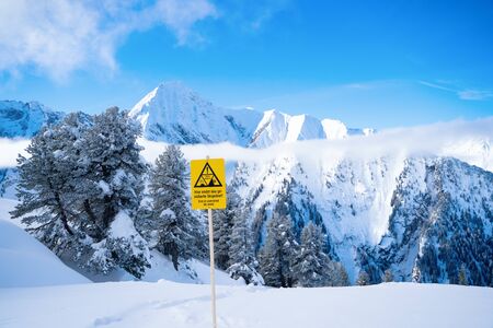 Photo of picturesque highlands with snow mountains, fir trees and blue sky