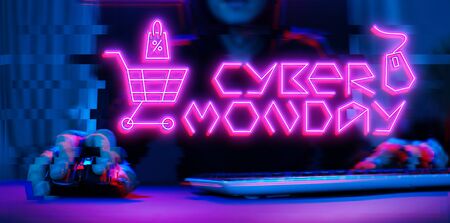 Man player with keyboard and mouse on black background, pink inscription.の写真素材