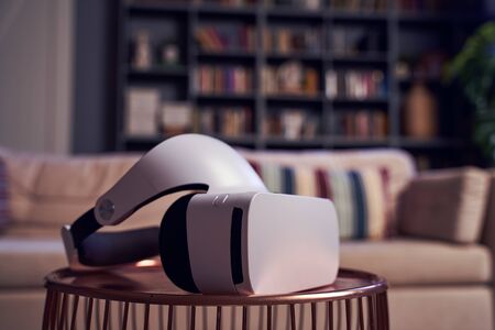 Virtual reality glasses on the table against the apartment on background. Concept of virtual...