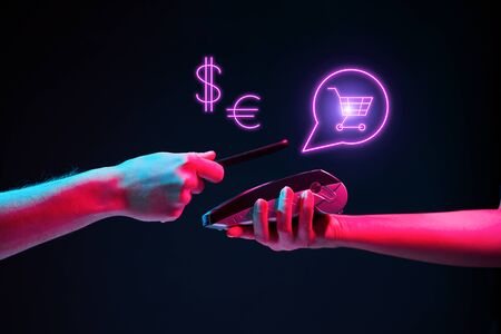 Payment transaction with smartphone. Modern neon color.の写真素材