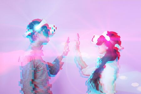 Couple in love communicate using a virtual reality headset. Image with glitch effect. Concept of...