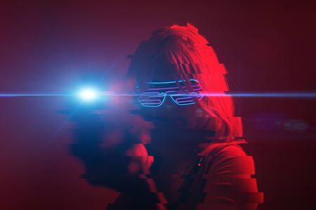Girl with blaster in the futuristic battle. Image with glitch effect.の写真素材