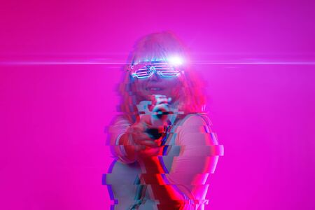 Girl with blaster in the futuristic battle.