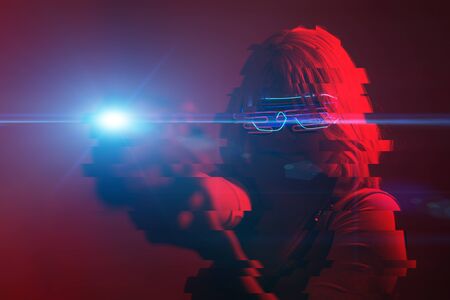 Girl with blaster in the futuristic battle. Concept virtual reality, cyber game. Image with glitch effect.の写真素材