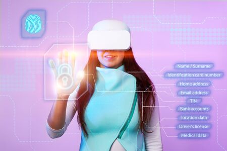 Woman is using vr headset to access for personal data.の写真素材