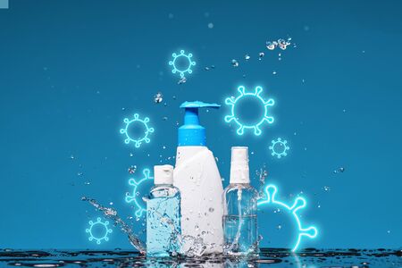 Bottle of antiseptic liquid soap, spray and gel in splashes of water. Concept of washing hand, hygiene.の写真素材