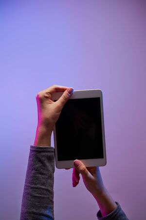 Humans hands with smartphone and blank black screenの写真素材