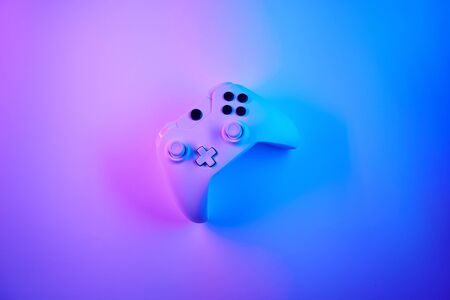 Gamepad in violet snd blue neon colors. Gamer concept.の写真素材