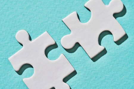 Two connecting puzzle piece. Concept of connection.の写真素材