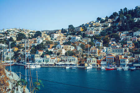 Greek island of Symi, Dodecanese, Greece - July 2019: Panoramic view of the picturesque islandのeditorial素材