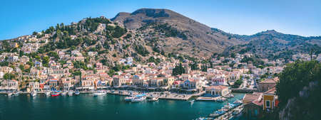Greek island of Symi, Dodecanese, Greece - July 2019: Panoramic view of the picturesque islandのeditorial素材