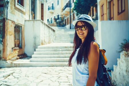 Happy traveler girl in Greek island of Symi, Dodecanese, Greeceの写真素材