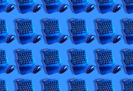 Seamless pattern with games keyboard and mouse on blue background.の写真素材