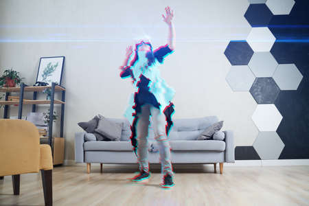 Woman is using virtual reality headset. Image with glitch effect.