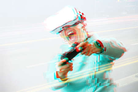 Woman with virtual reality headset is playing game. Image with glitch effect. Concept of virtual...