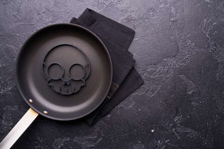 Skull shape for making scrambled eggs for breakfast for Halloween.の写真素材