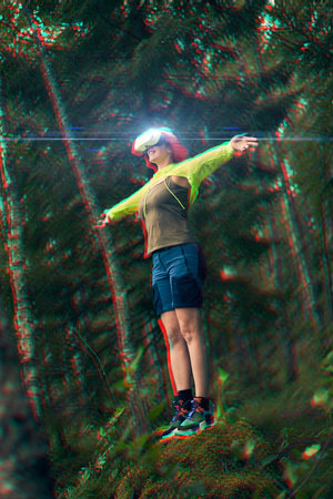 Woman goes into virtual reality using virtual reality headset. Image with glitch effect.の写真素材