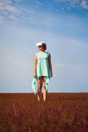 Woman goes into virtual reality using virtual reality headset.