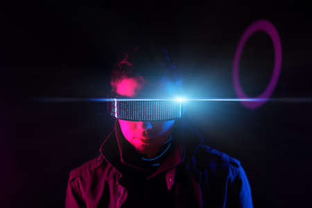 Cyberpunk style portrait of man in futuristic costume.