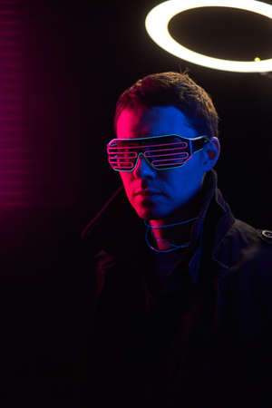 Cyberpunk style portrait of man in futuristic costume.
