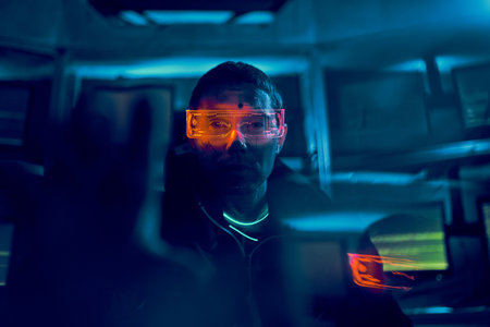 Portrait of a cyber hacker stealing information using a computer.の写真素材