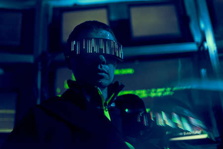 Cyber hacker breaks into databases to obtain information using a computer.の写真素材