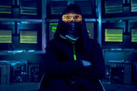 Portrait of a cyber hacker stealing information using a computer.