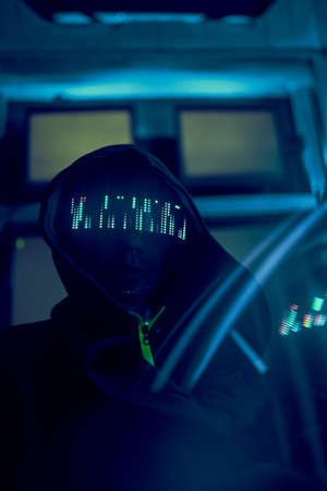 Cyber hacker breaks into databases to obtain information using a computer.の写真素材