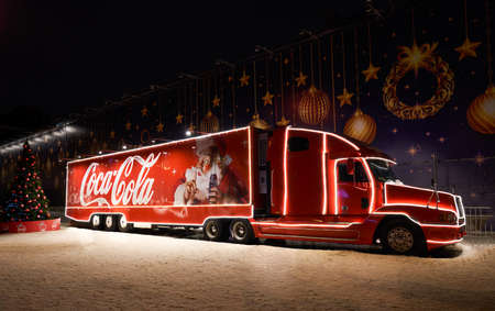 Saint Petersburg, Russia - January 2022: Beautiful Christmas Coca Cola truck at night street
