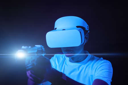 Man with virtual reality headset is playing game.