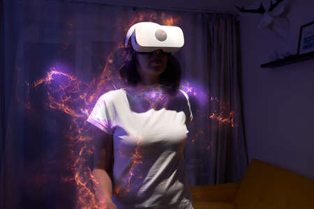 Woman is using virtual reality headset.の写真素材