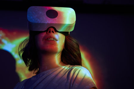 Woman is using virtual reality headset.の写真素材