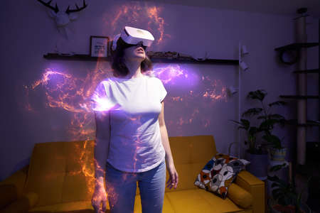 Woman is using virtual reality headset.