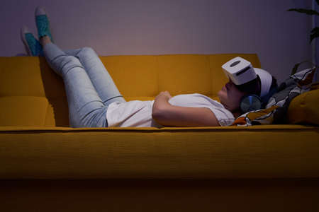Woman interacts with virtual reality using a vr headset.