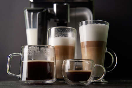 Group of cup with different freshly types of coffee: cappuccino, latte and espresso.の写真素材