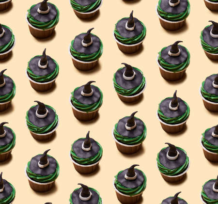 Seamless pattern of Halloween treat maffin decorated witch hats.の写真素材
