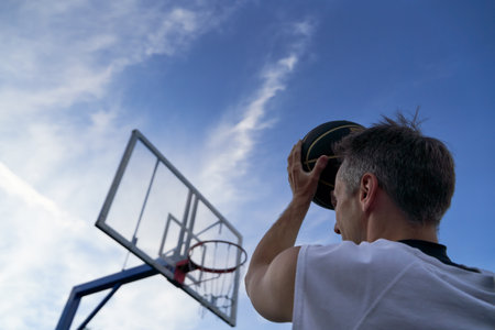 Man is throwing ball to the hoop. Training of basketballの写真素材