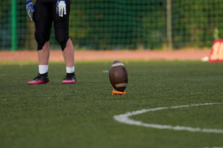 Ball for american football on green grassの写真素材