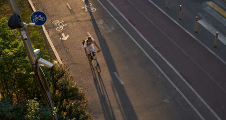 Man bicycling on cycling road. Top aerial view.