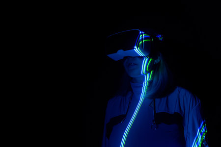 Woman is using virtual reality headset to access in .の写真素材