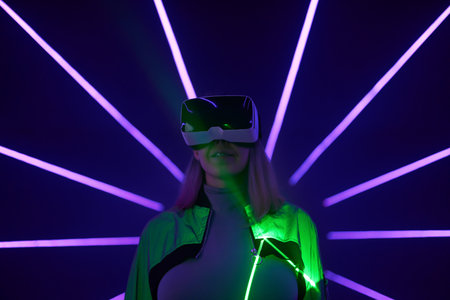 Woman is using virtual reality headset to access in metaverse.の写真素材