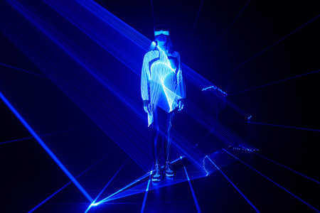 Woman is using virtual reality headset to access in metaverse.の写真素材