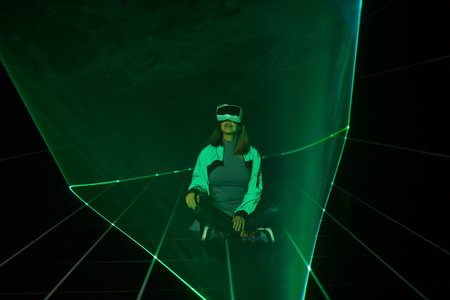 Woman is using virtual reality headset to access in metaverse.の写真素材