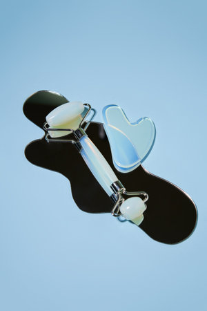 Blue jade face roller and Gua Sha scraping for beauty facial massage therapyの写真素材
