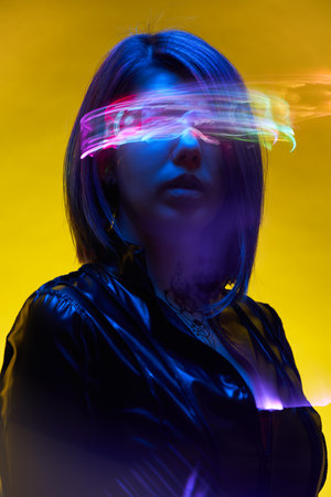 Woman is using augmented reality headset. Concept of virtual, augmented and extended reality.の写真素材