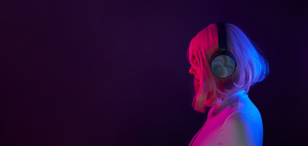 Woman in headphones listening music and enjoingの写真素材