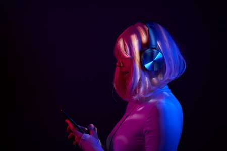 Woman in headphones listening music and enjoingの写真素材